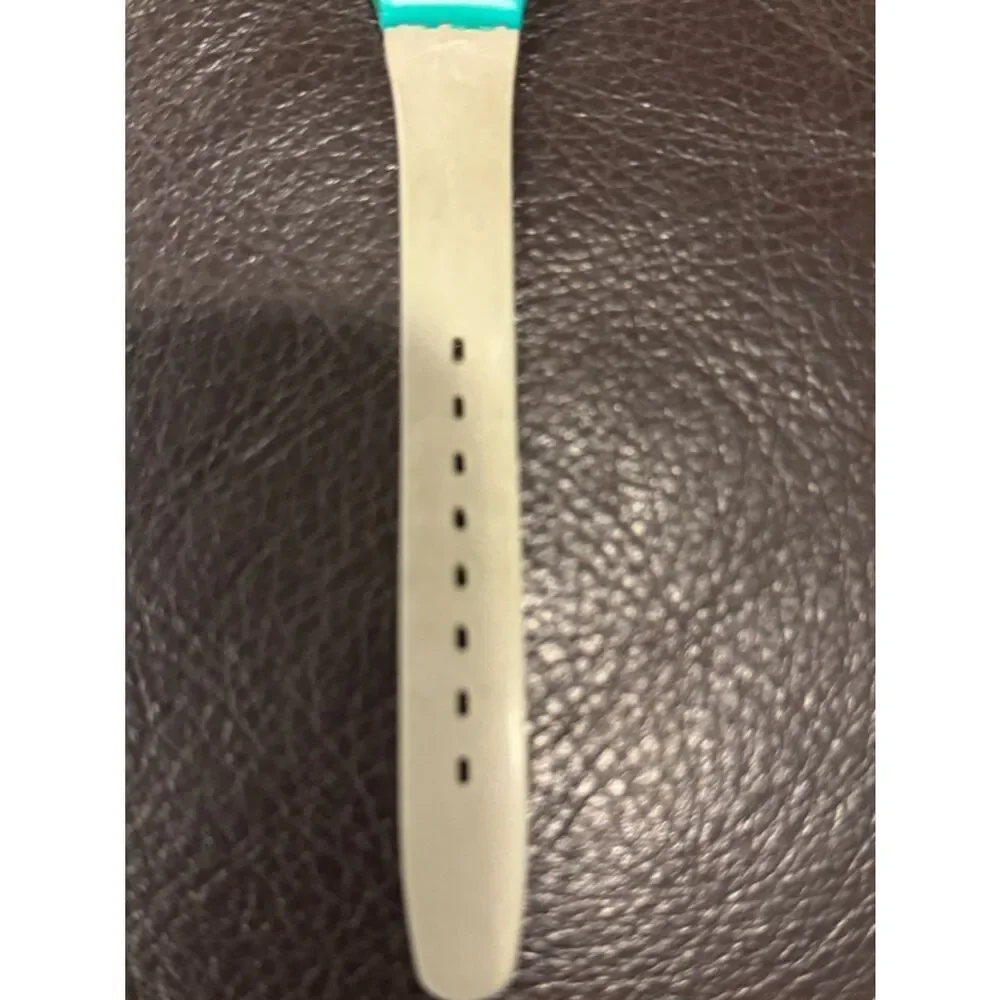 Vintage 1986 Swatch Lady HORUS LL101 Watch – Teal Case, Orange Hieroglyph Dial